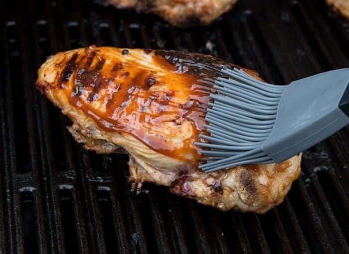 Brushing Barbecue Grilled Chicken with Marinade