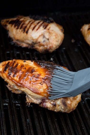 Brushing Barbecue Grilled Chicken with Marinade
