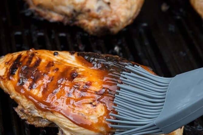 Brushing Barbecue Grilled Chicken with Marinade