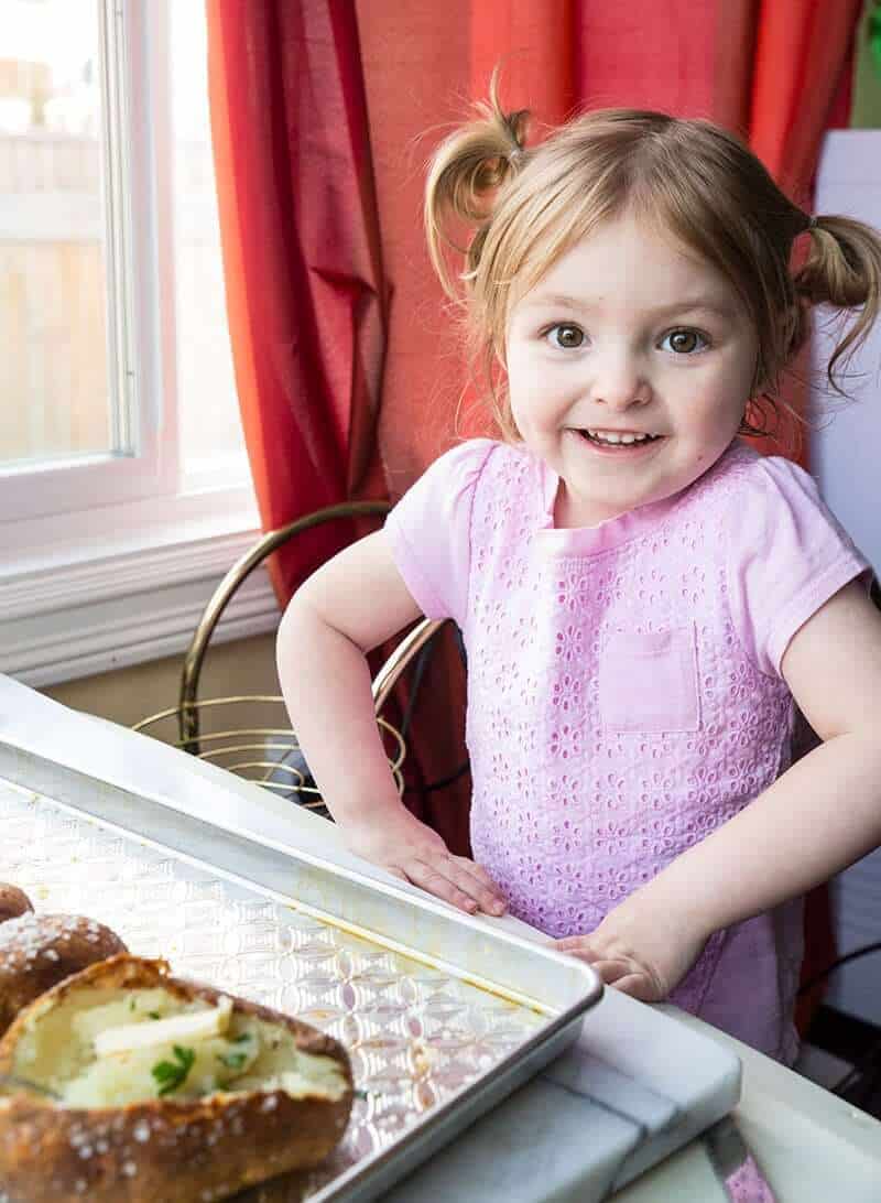 my niece enjoying baked potatoes, her favourite food!