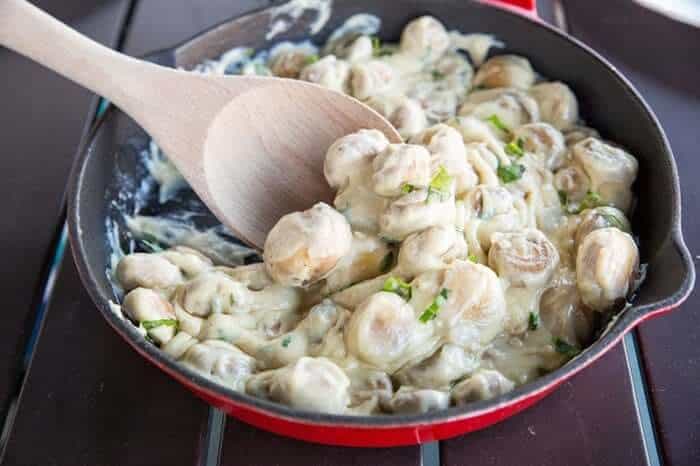 Rich and Creamy Parmesan Garlic Sautéed Mushrooms in a large skillet