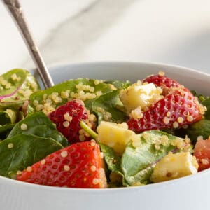 strawberry quinoa salad CLOSEUP IN A WHITE BOWL