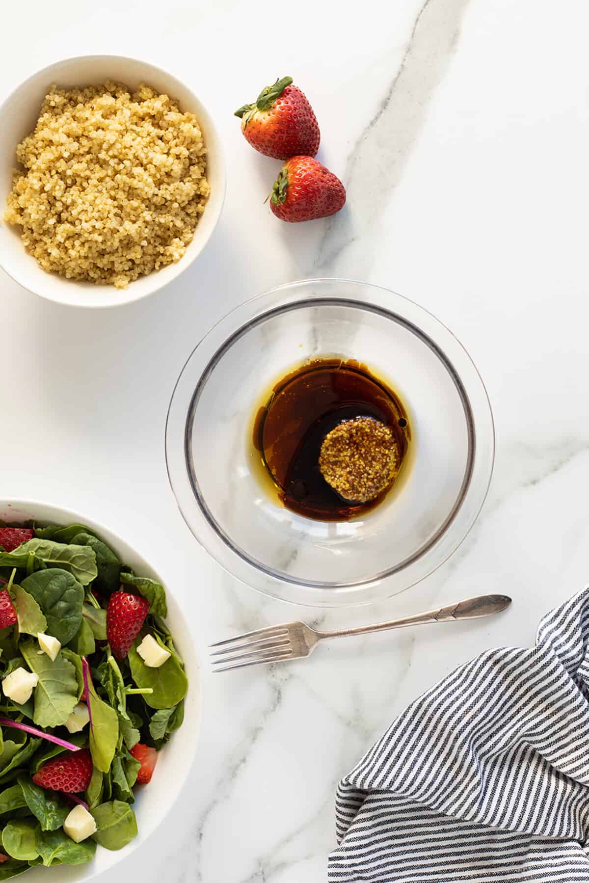 strawberry quinoa salad vinaigrette in bowl unmixed 