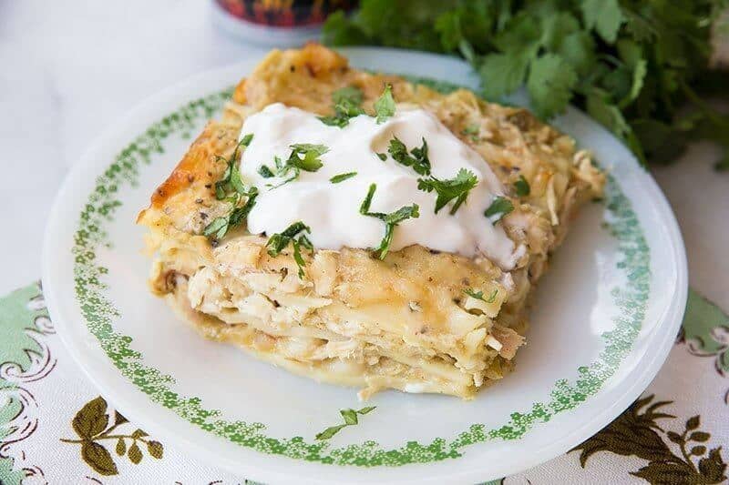 Serving of Cheesy Green Chile Chicken Lasagna in a plate with green prints