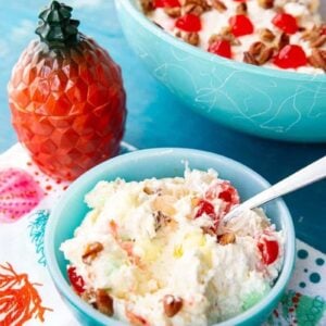 close up of Hawaiian Cheesecake Fluff Dessert Salad in jade blue serving bowl