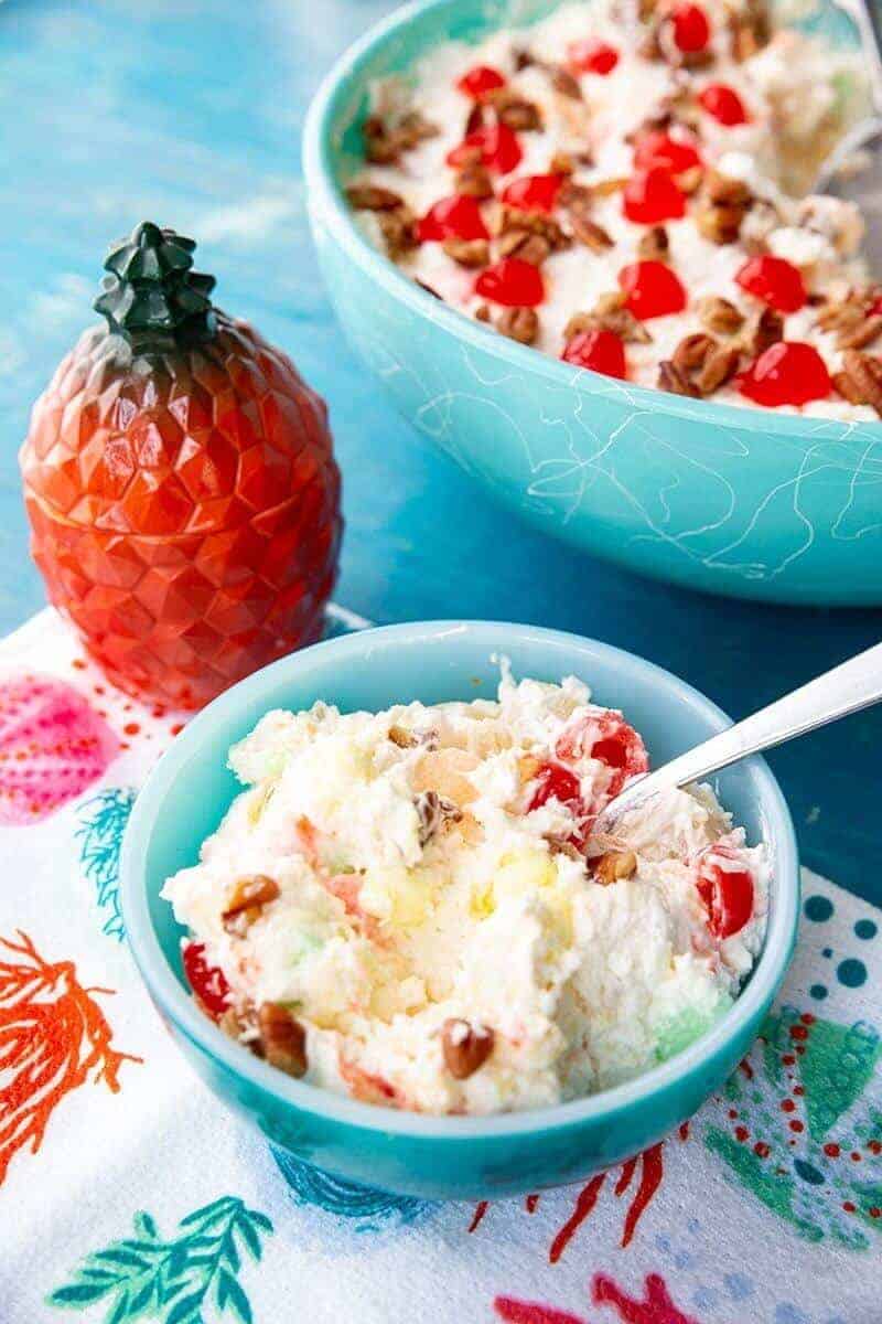 close up of Hawaiian Cheesecake Fluff Dessert Salad in jade blue serving bowl