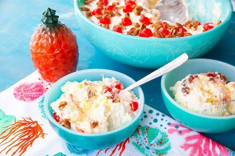 Hawaiian Cheesecake Fluff Dessert Salad in jade blue serving bowls