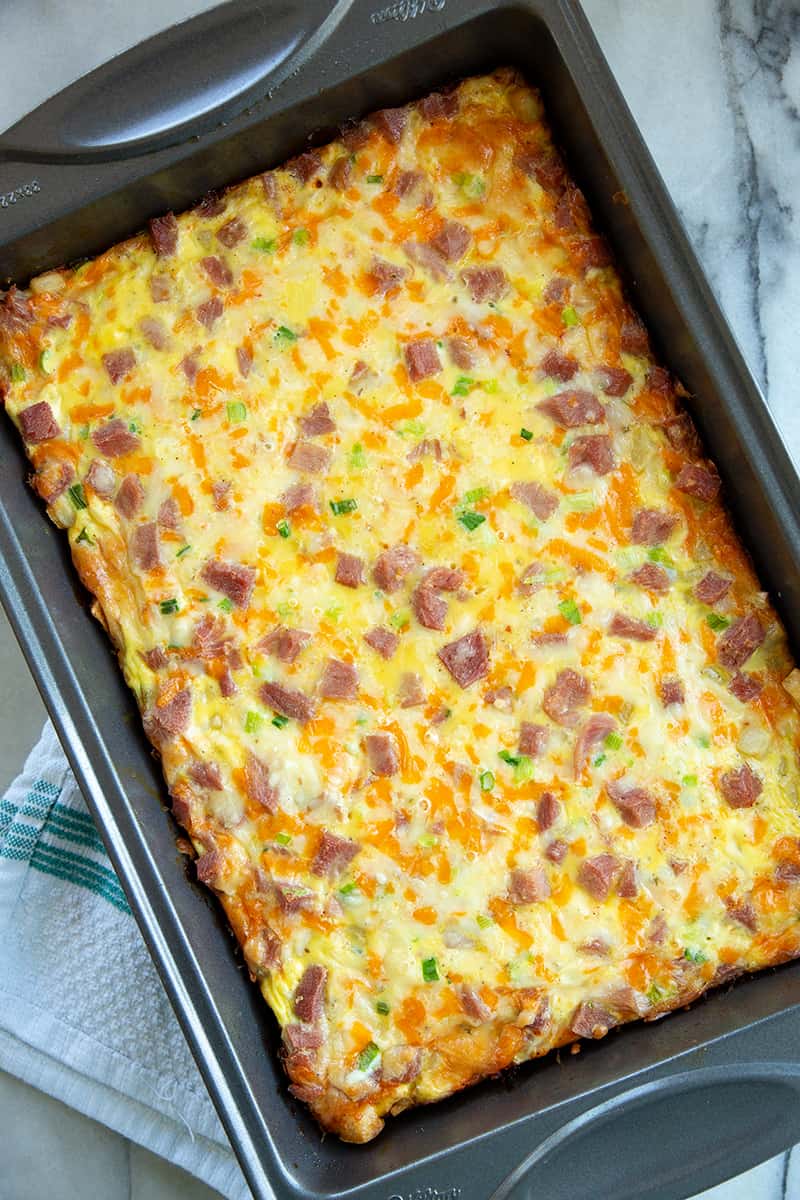top down photo of a baked hash brown casserole in a 9x13 pan