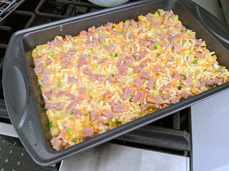 uncooked hash brown casserole in a 9x13 pan 