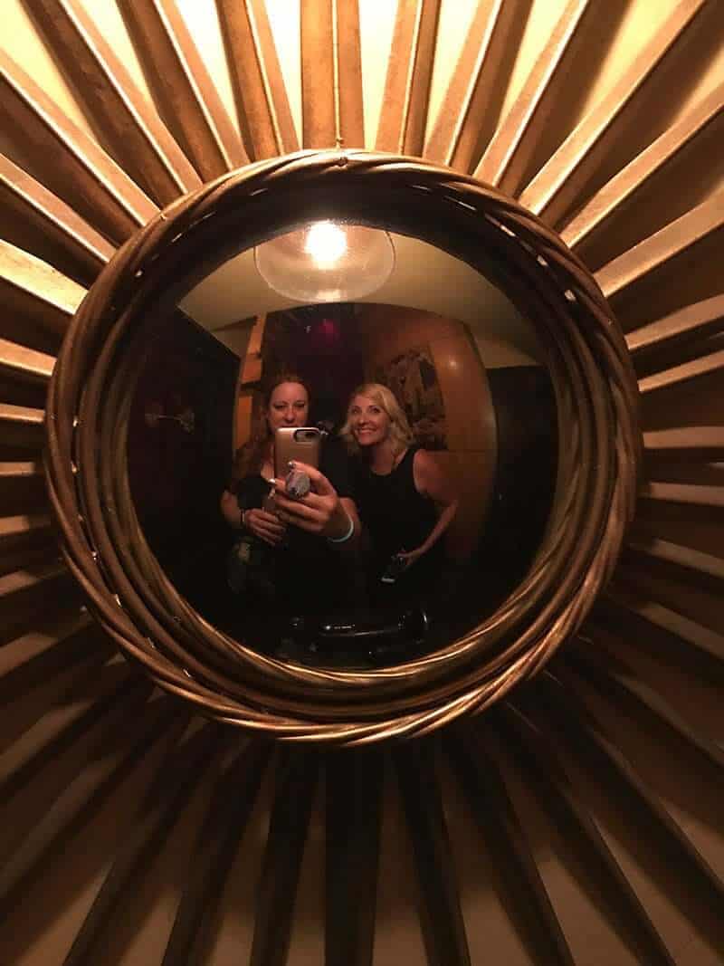 2 ladies taking mirror selfies at the Dean's pub