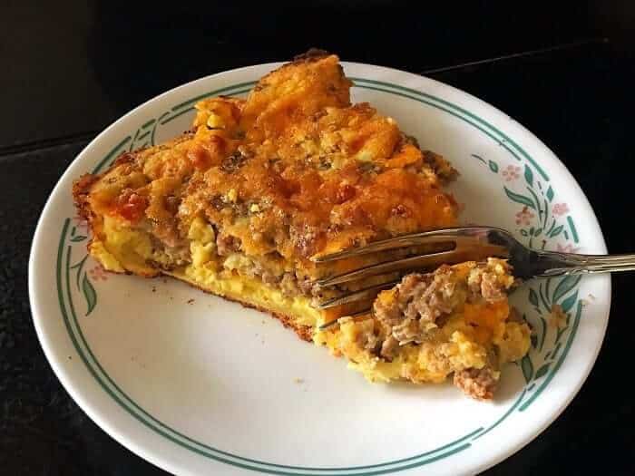 using a fork in a slice of Leftover Meatloaf Quiche in a Corelle plate