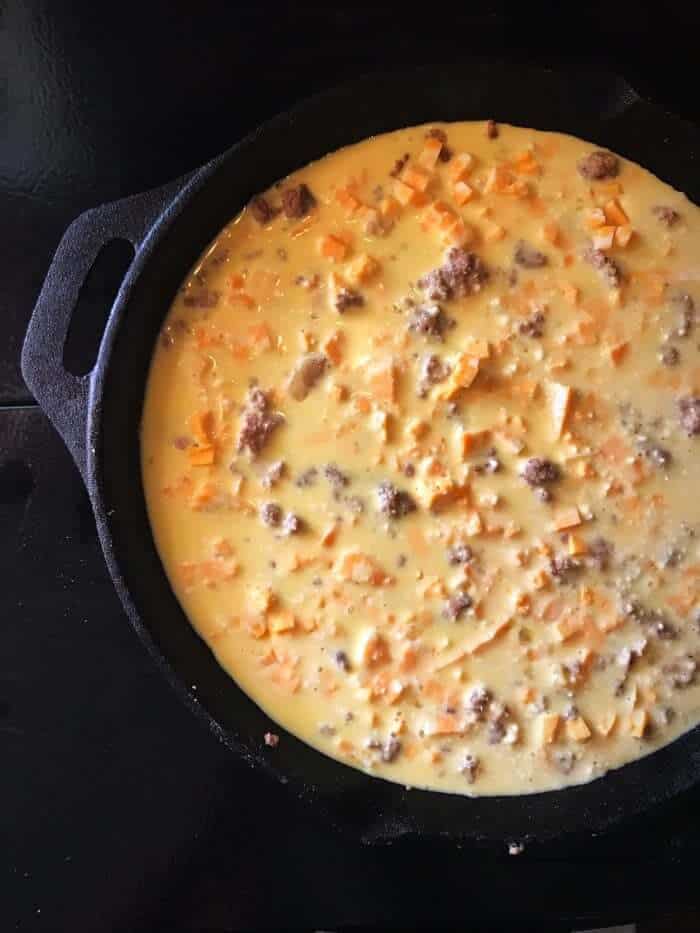 Chopped up leftover meatloaf with egg mixture poured over top of mixture