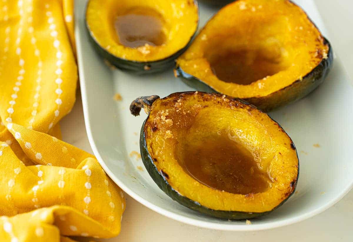  half slices Acorn Squash in white plate