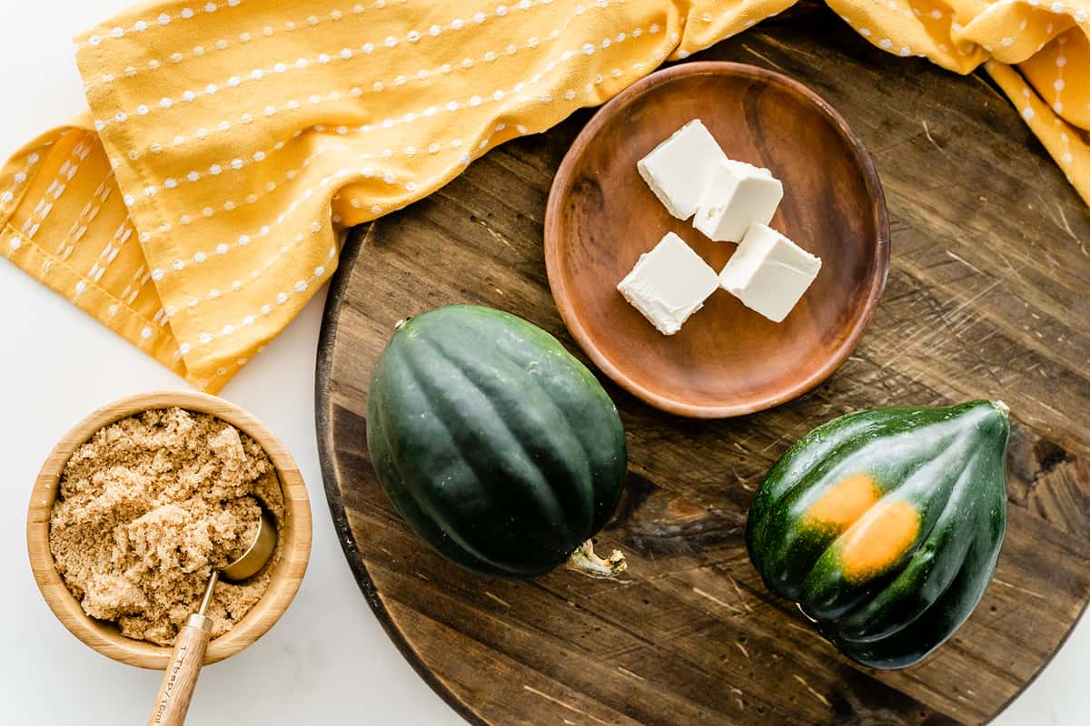 ingredients for acorn squash in wooden plate and board