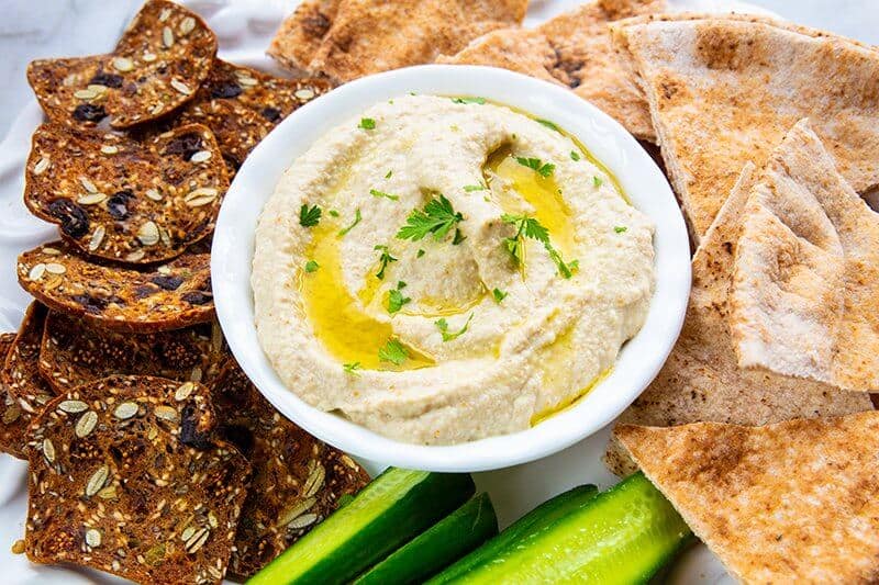 Baba Ganoush in a dipping saucer with oven baked pita chips