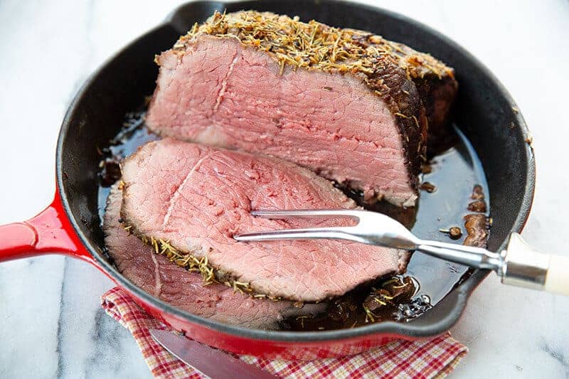 Herb & Garlic Bottom Round Roast in a red skillet 