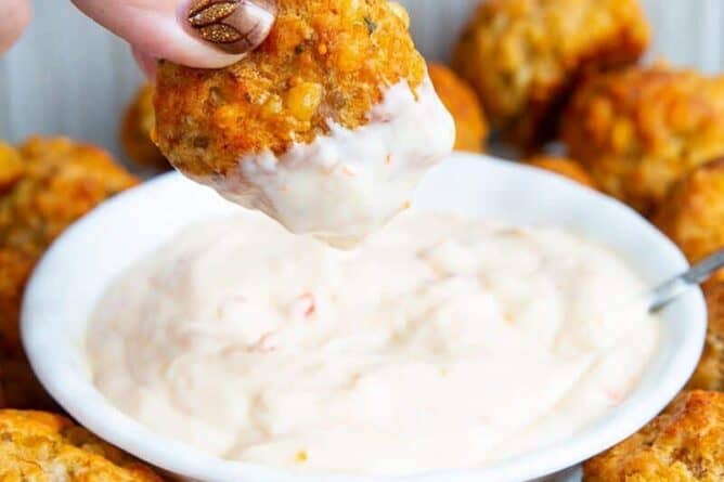 dipping a sausage ball in dipping sauce