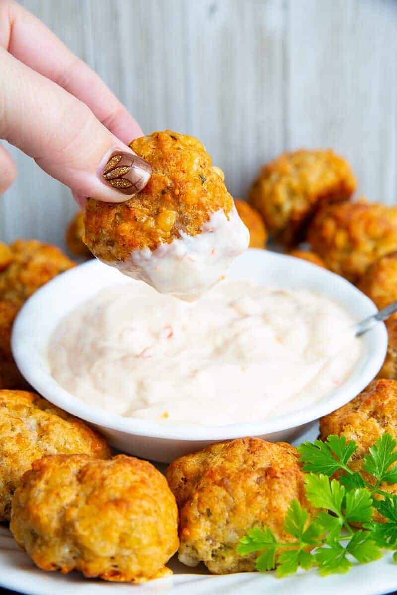 dipping a sausage ball in dipping sauce