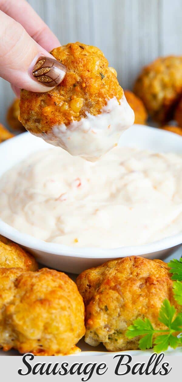These biscuit mix (Bisquick) cheesy sausage balls are a holiday staple as an appetizer and also grace many a table for holiday breakfasts as well! Only three ingredients and you have a delicious snack or side! #sausage #sausageballs #bisquick #appetizer #breakfast #holiday #thanksgiving #christmas #dinner #recipe #snack #entertaining 