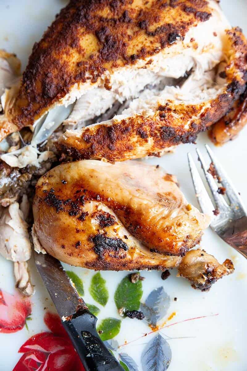 slicing the Crockpot Rotisserie Chicken and showing the inside