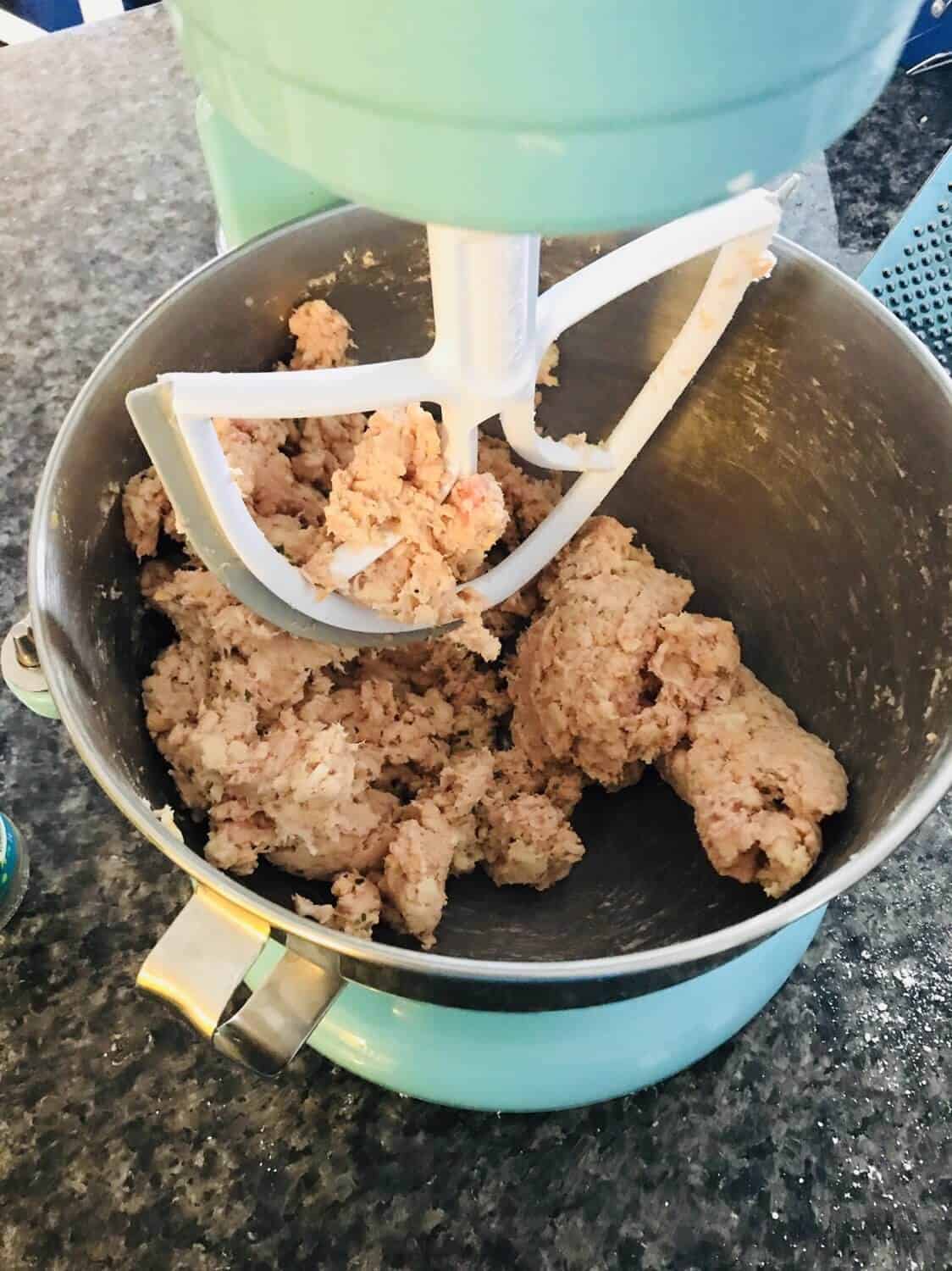 using a mixer to combine all the ingredients