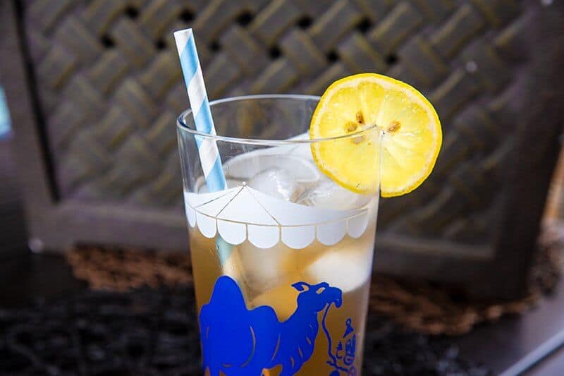 Arnold Palmer Drink in a vintage glass with ice cubes and slice of lemon for garnish