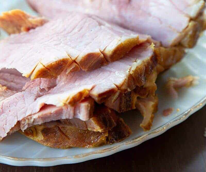 sliced precooked ham with Brown Sugar Mustard Glaze in a plate