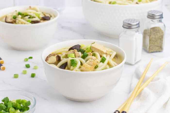 Chicken Mushroom Udon Noodle Soup in a white bowl
