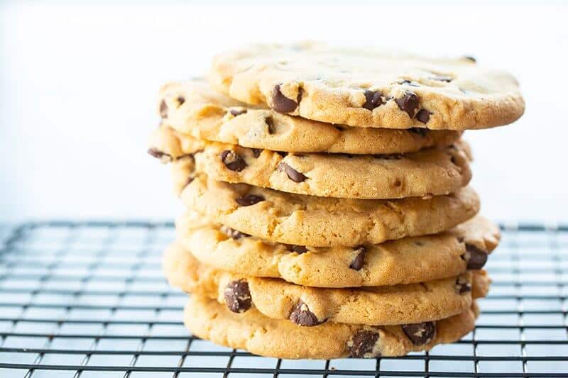 stack of Crispy Chocolate Chip Cookies in black cooling rack