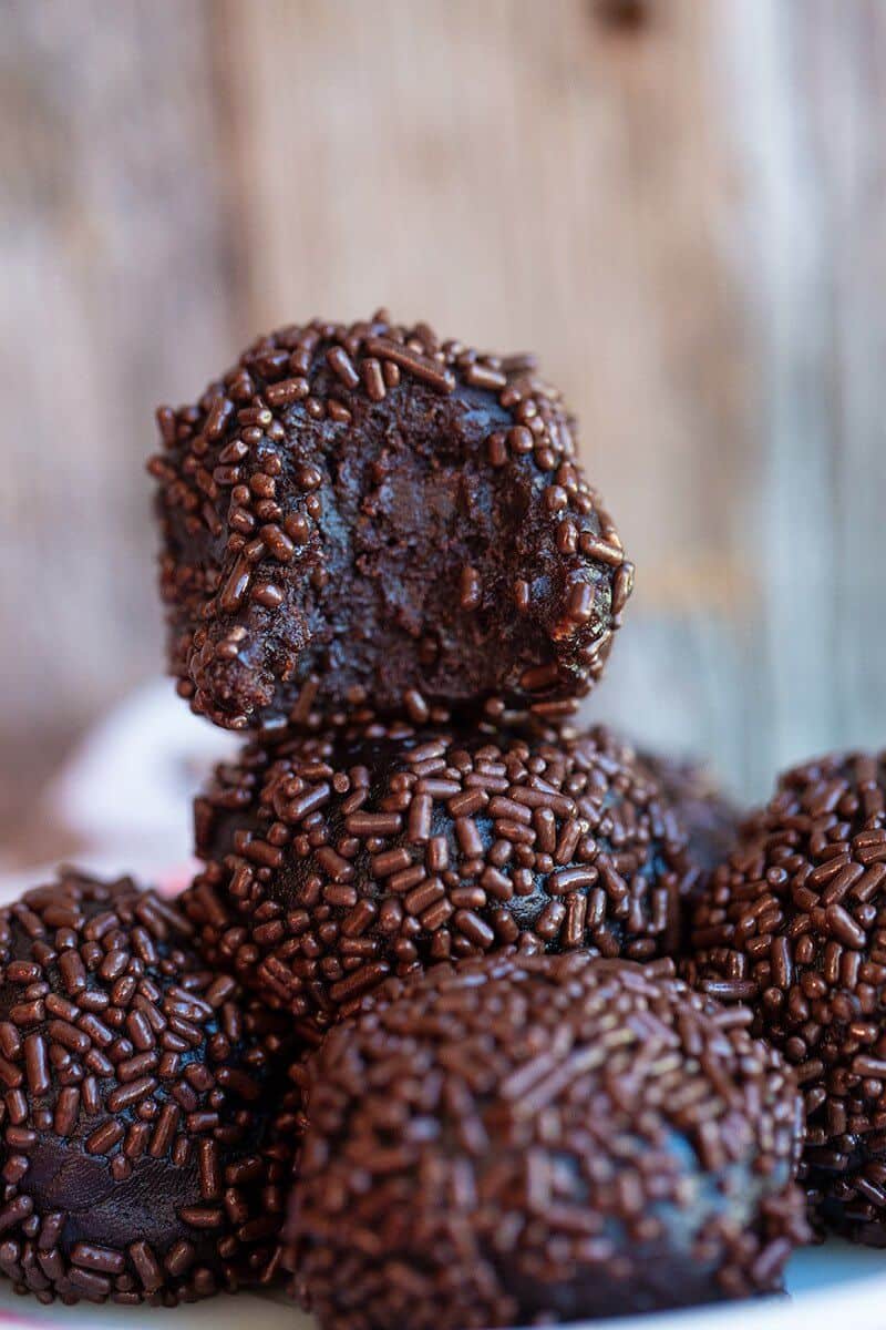 close up rum balls or bourbon balls rolled in sprinkles