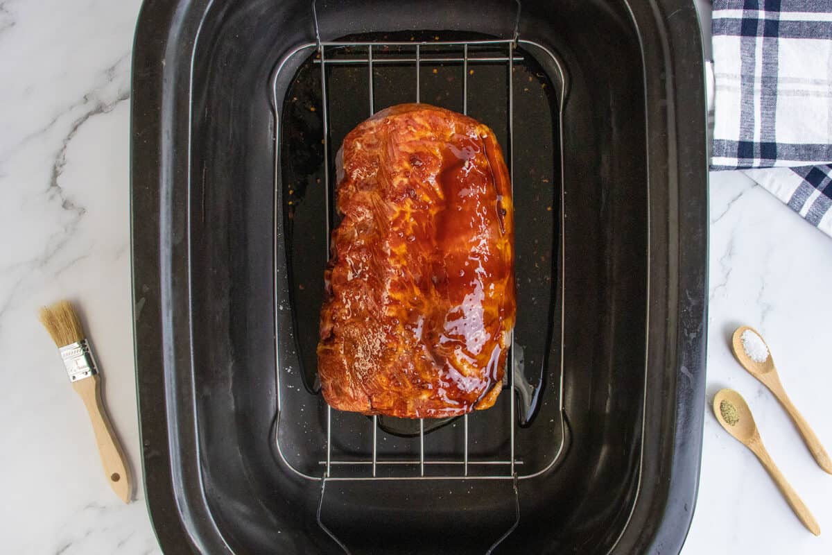 basted pork rib roast on a wire rack