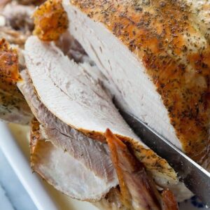 Roast Turkey Breast Meat Being Sliced