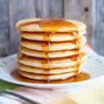adding syrup on a stack of Bisquick® Pancakes