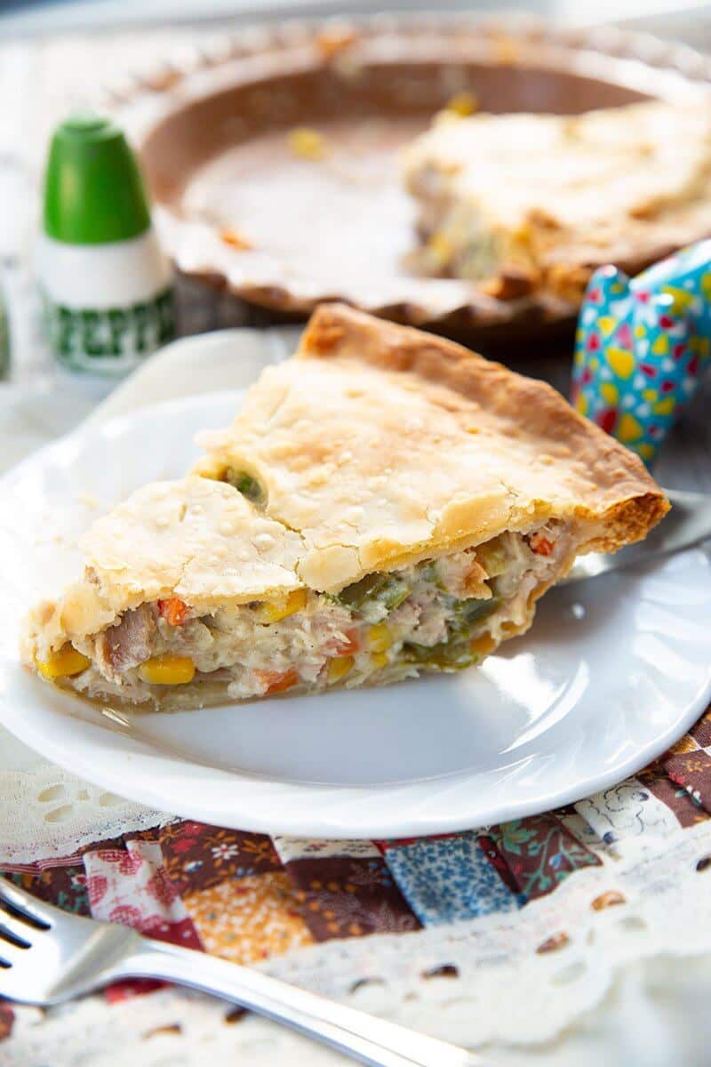 white plate with a slice of Turkey Pot Pie ready to be enjoy!