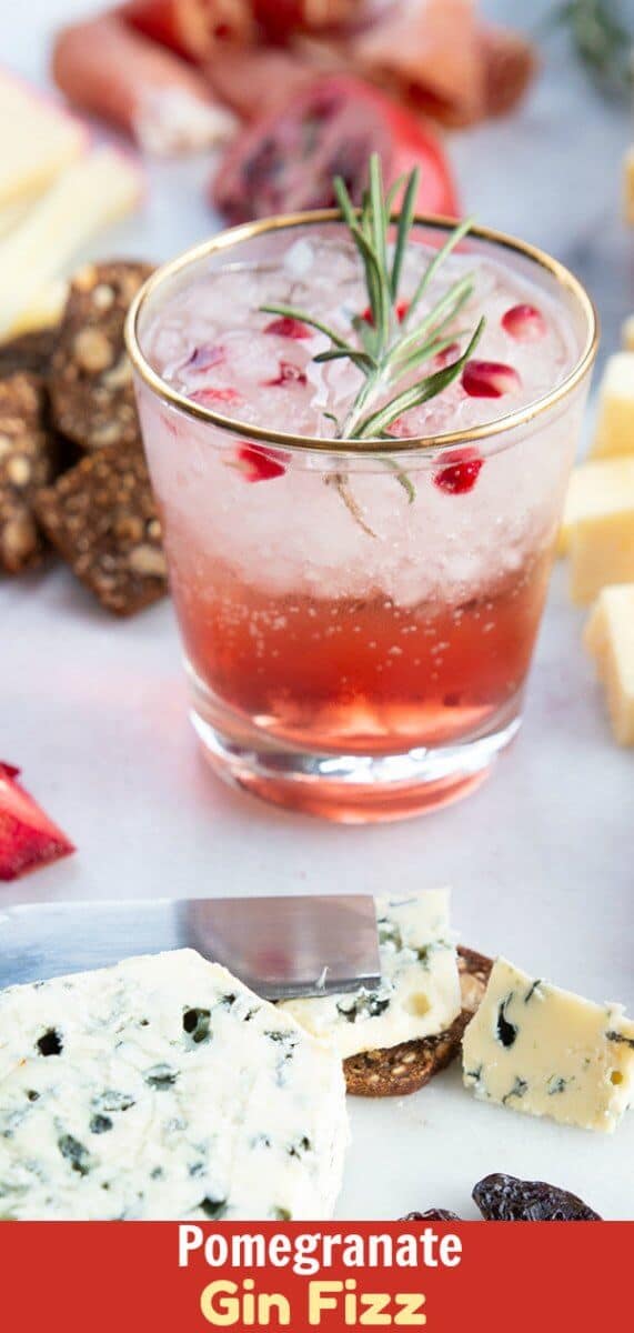 This Pomegranate Gin Fizz is perfect for winter gatherings & Christmas parties! This beautiful and light drinking cocktail will definitely impress your guests. #gin #cocktail #christmas