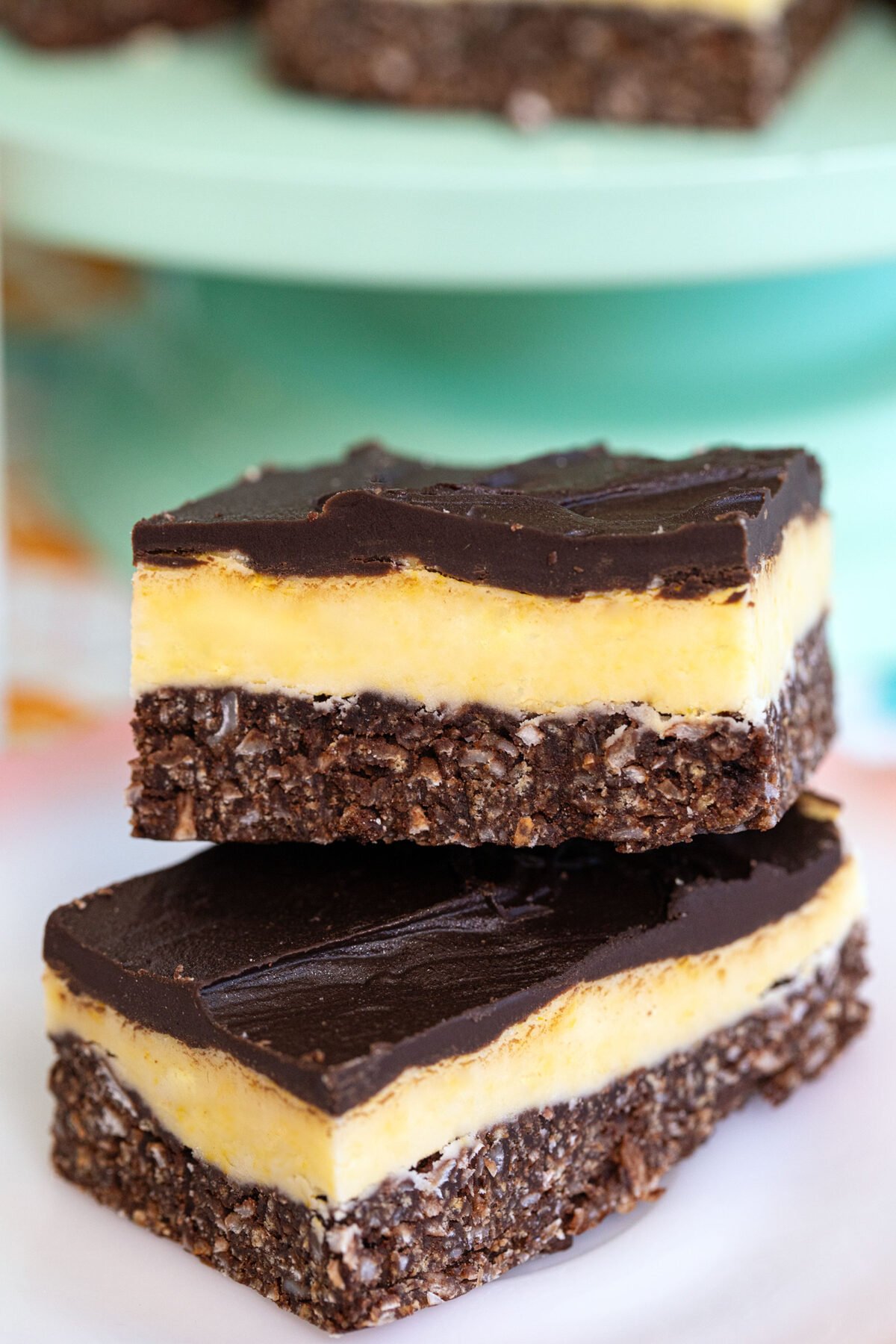 close up of a pile stack of Nanaimo bars