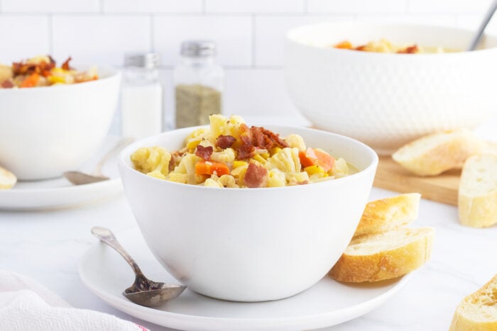 Cauliflower corn bacon chowder in a white bowl