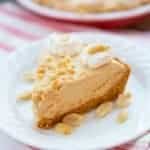 a slice of Classic No-Bake Peanut Butter Pie in a white dessert plate