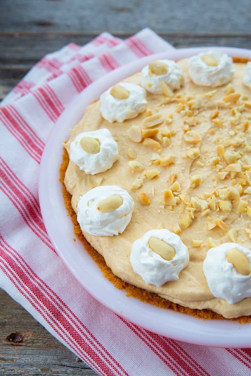 whole peanut butter pie in a white pie plate