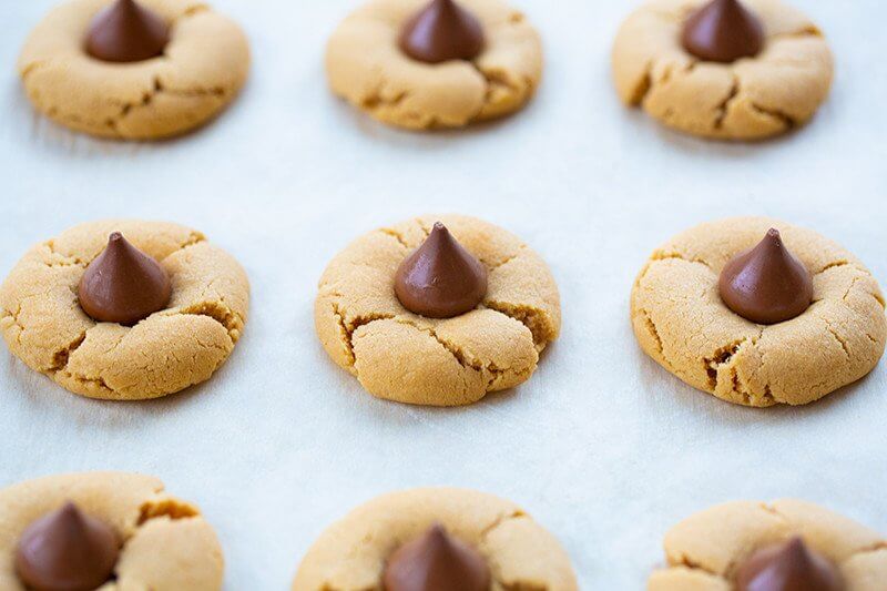 Peanut Butter Blossom Hershey Kiss Cookies in parchment paper