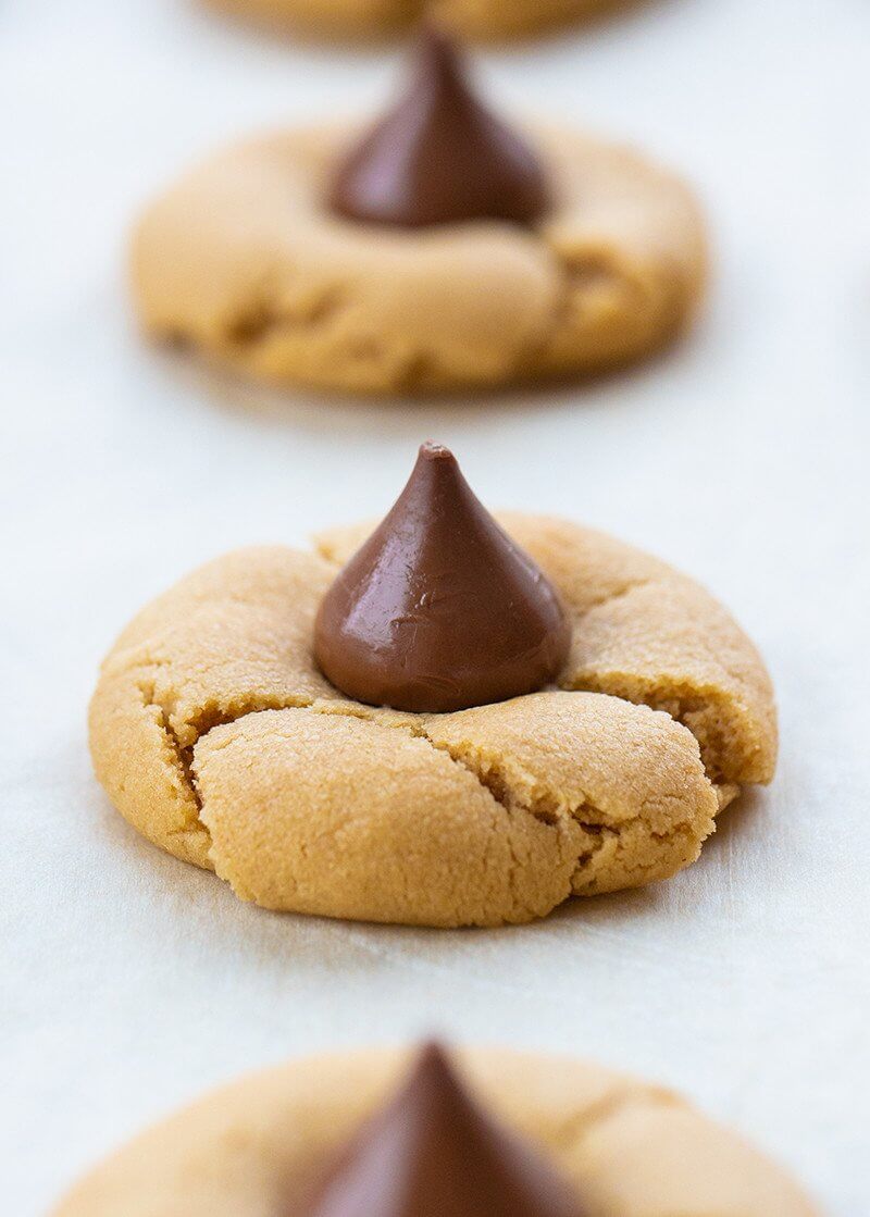 close up Peanut Butter Cookies with unwrapped Hershey's kiss in the middle