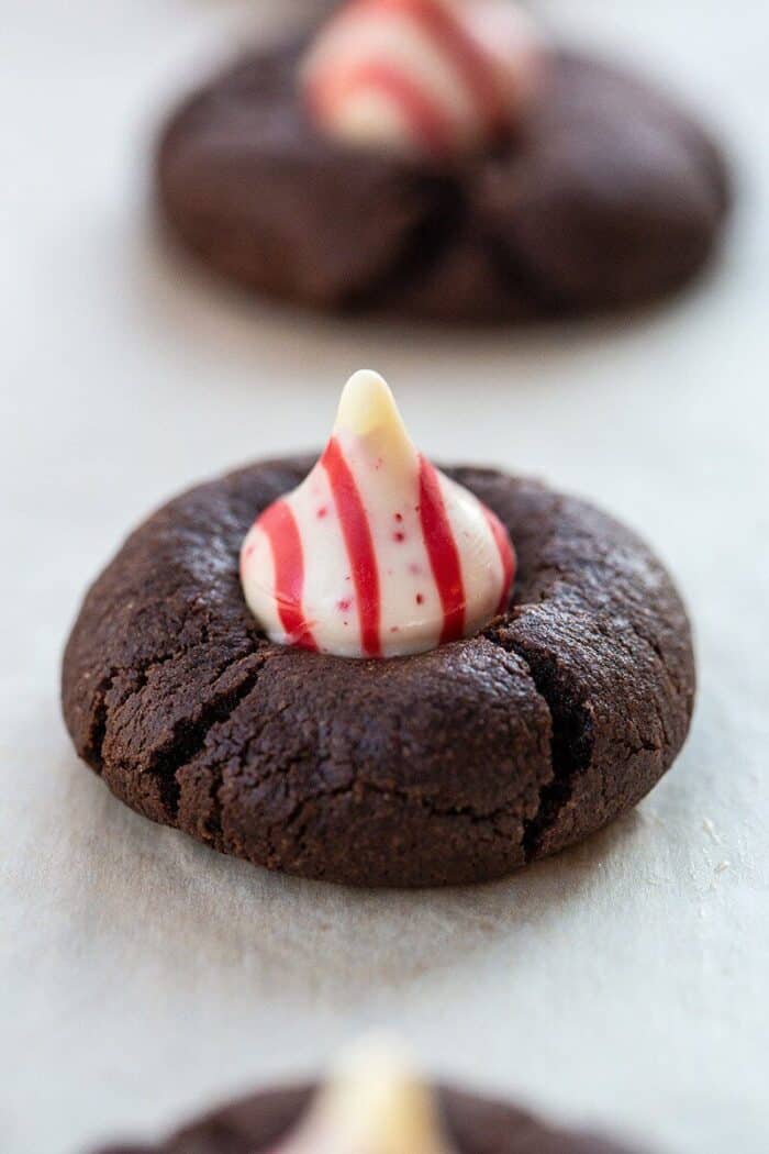 close up Chocolate Cookies with White Chocolate Peppermint Kisses on Top