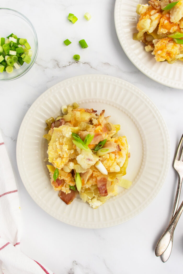 pierogi casserole on white plate with fork