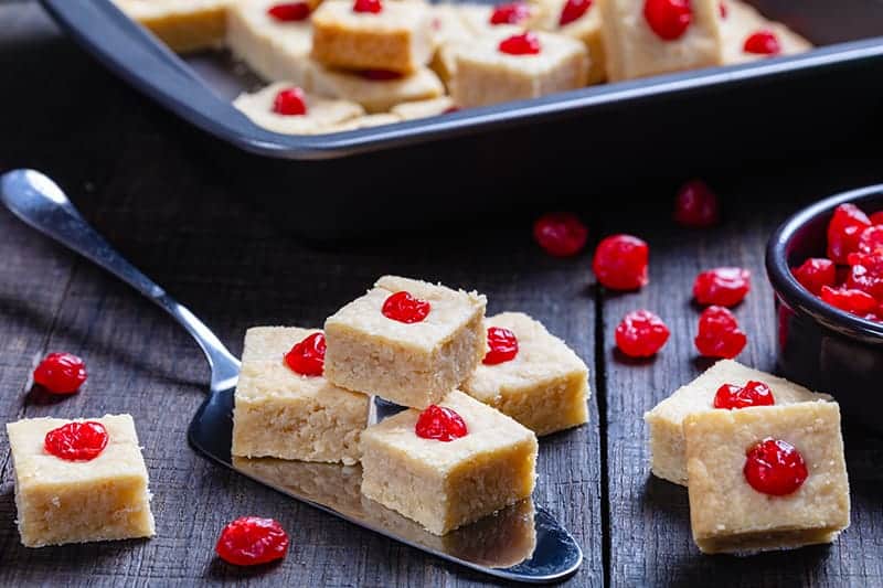 close up Shortbread Bites with candied cherries on top