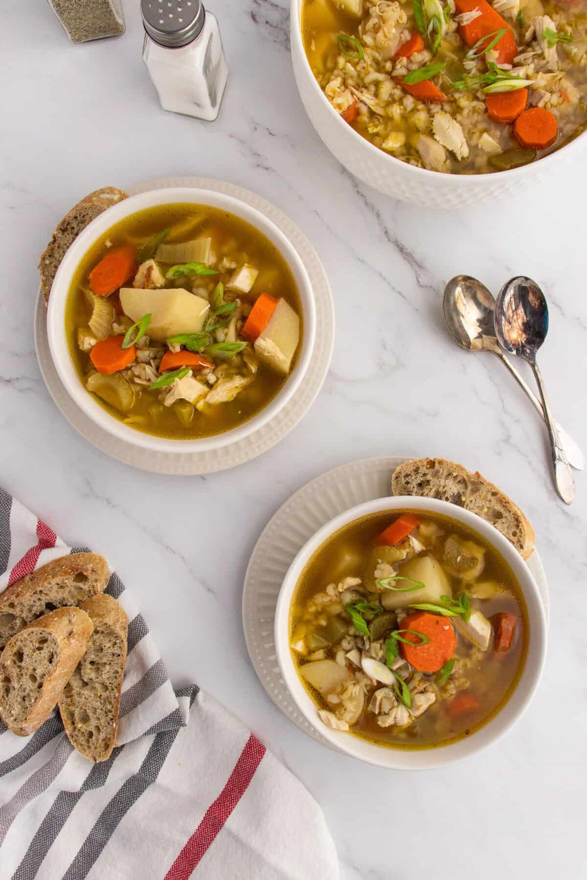 two bowls of chicken barley soup