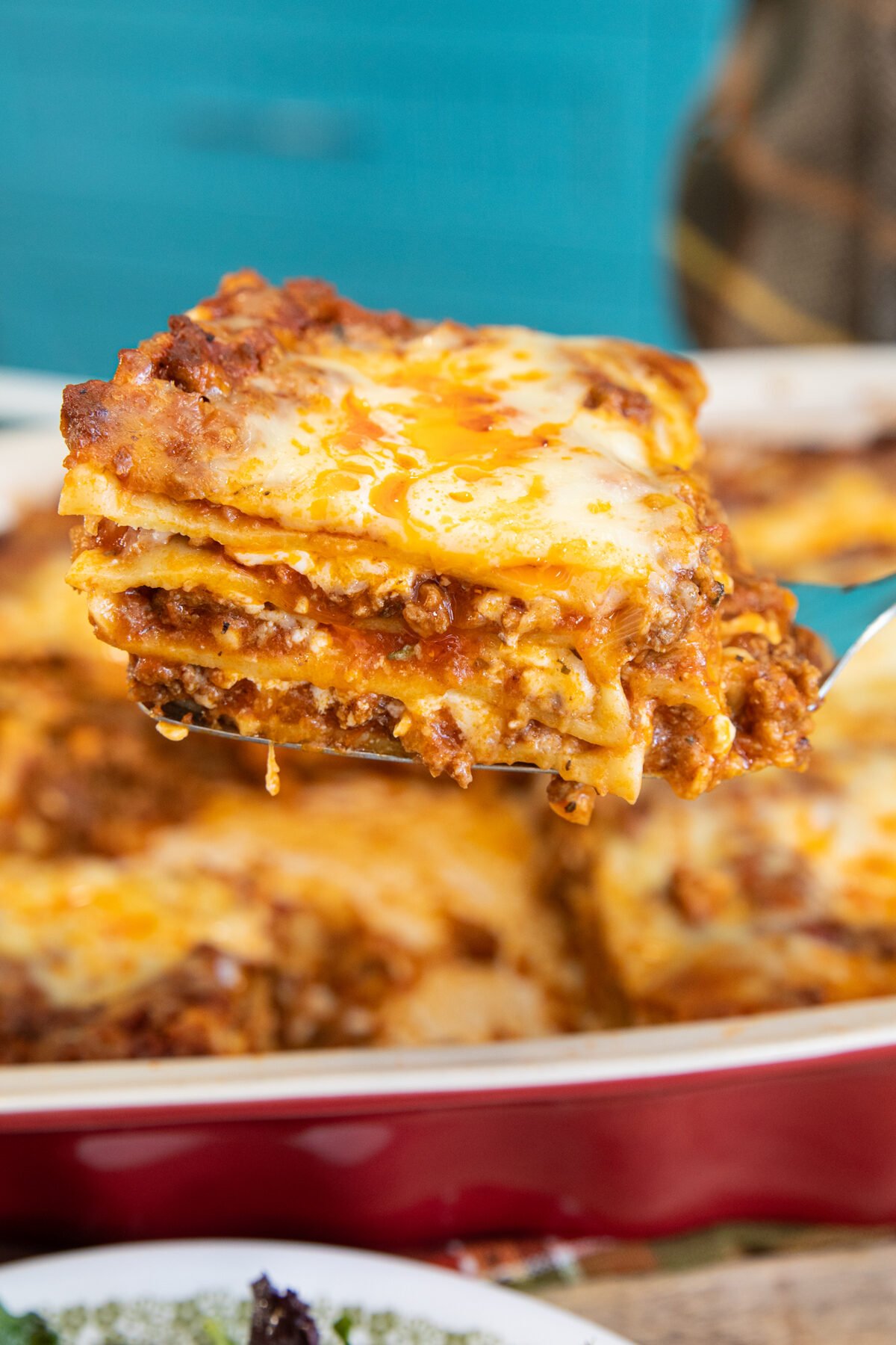 a slice of cottage cheese lasagna on a spatula turner