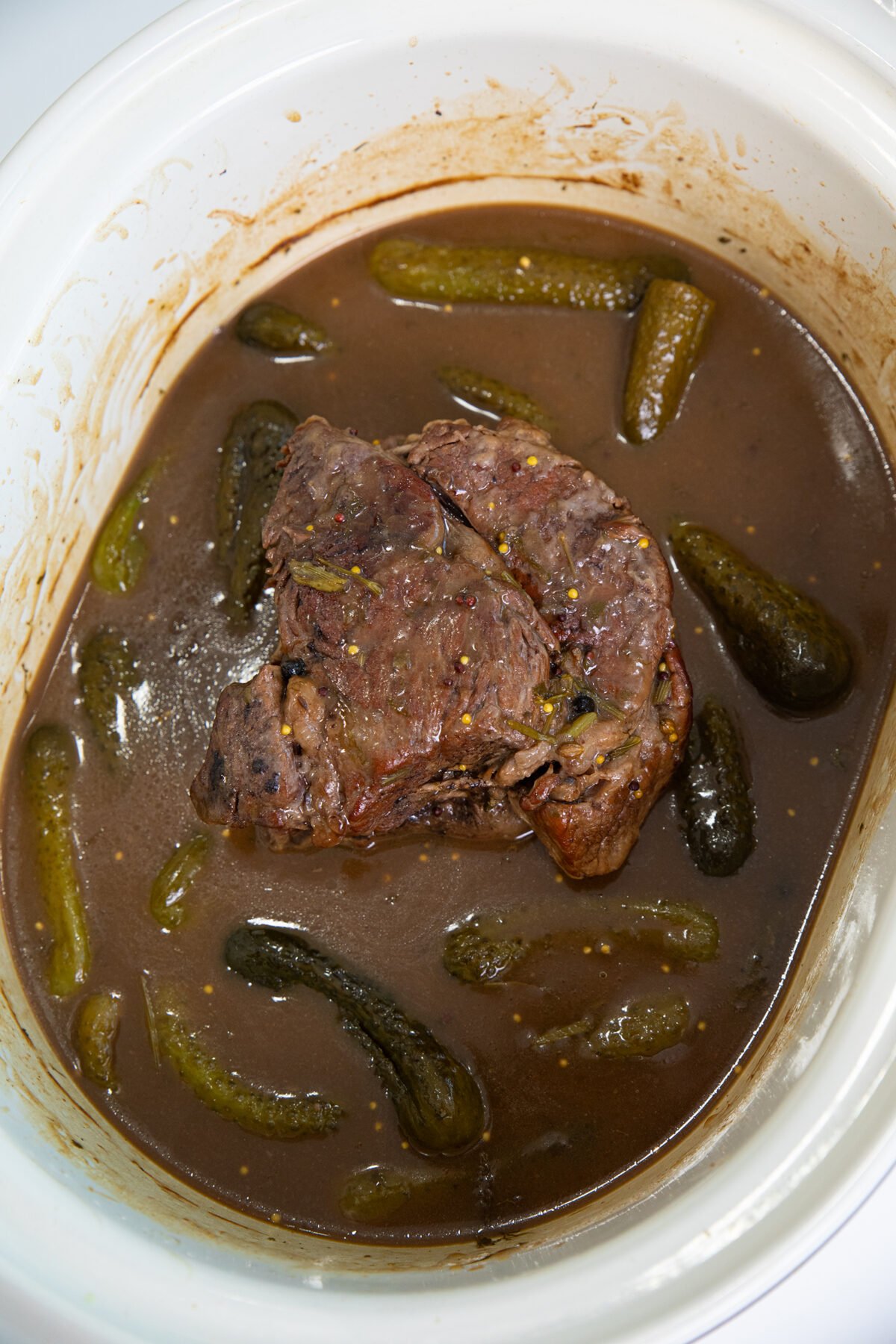 completely cooked dill pickle pot roast in slow cooker