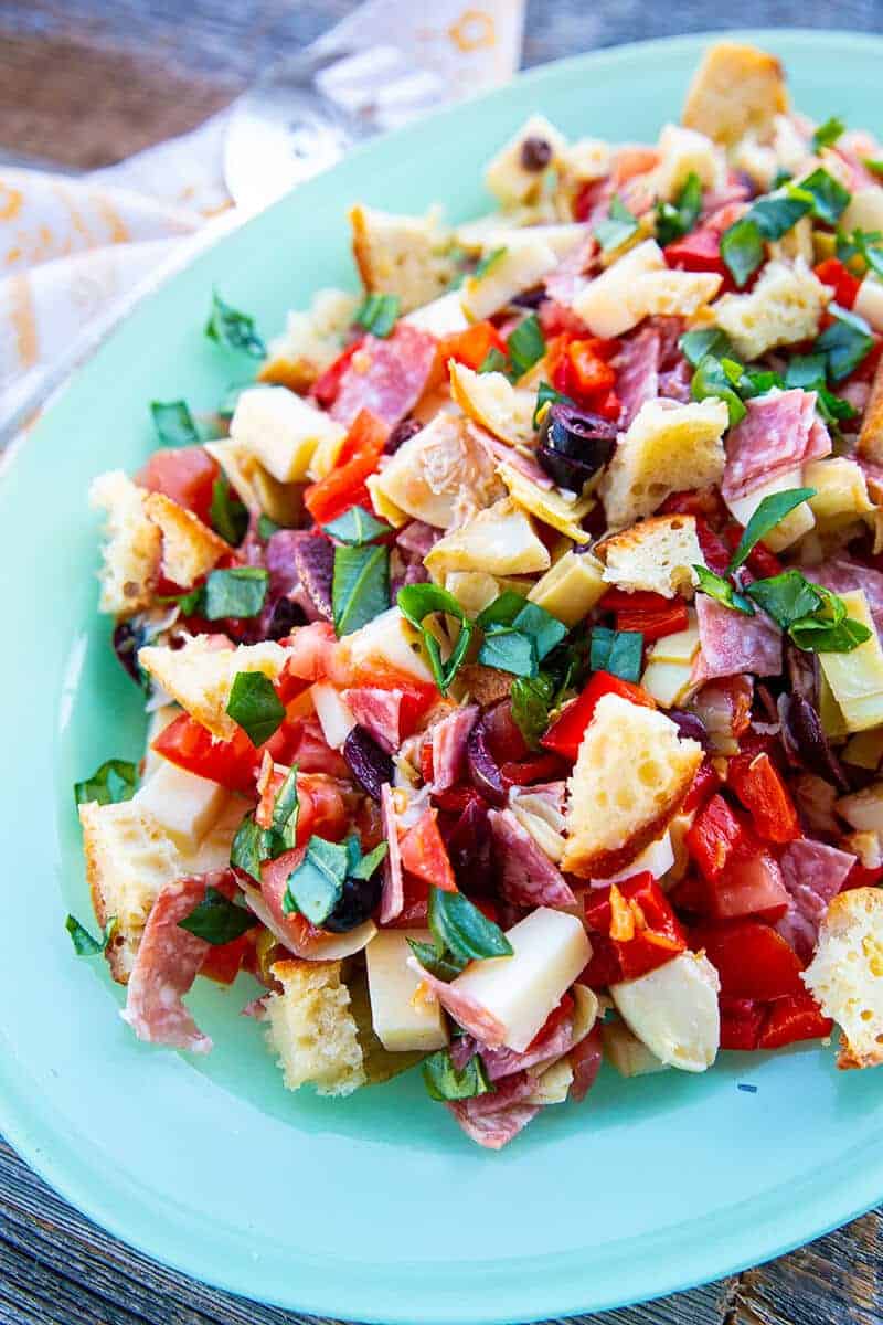 close up Homemade Antipasto Salad in jade blue plate