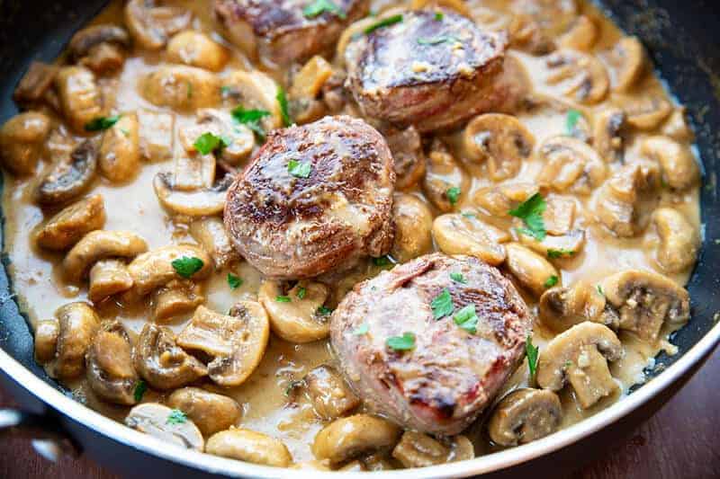 Bacon Wrapped Beef Tenderloin With Creamy Mushroom Sauce