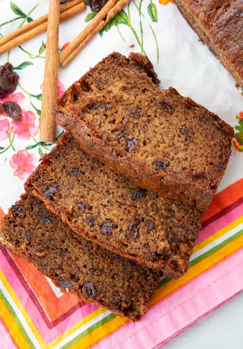 close up Raisins, cinnamon sticks and slices of Cinnamon Raisin Banana Bread